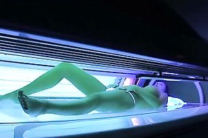 Perfect breasty dark brown hottie in the solarium naked on hidden camera