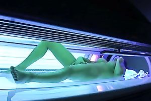 Perfect breasty dark brown hottie in the solarium naked on hidden camera
