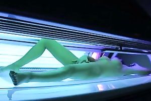 Perfect breasty dark brown hottie in the solarium naked on hidden camera