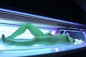 Perfect breasty dark brown hottie in the solarium naked on hidden camera