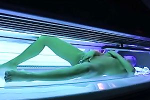 Perfect breasty dark brown hottie in the solarium naked on hidden camera