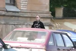 Her red constricted jeans are warm and wet after pissing