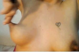 Webcam slut enjoys playing with her admirable natural milk cans