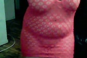 Curvaceous and bosomy dilettante shows off her booty in fishnet suit