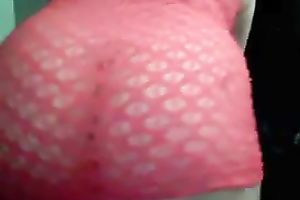 Curvaceous and bosomy dilettante shows off her booty in fishnet suit
