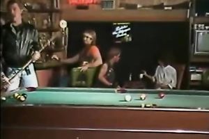 Dirty floozy wags her butt standing on a bar counter