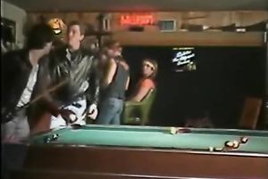 Dirty floozy wags her butt standing on a bar counter