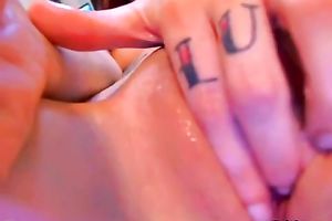 Webcam solo with a tattooed legal age teenager rubbing her bawdy cleft and engulfing a sextoy
