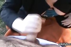 Hungry bimbo sucks her lover's moist penis outdoors