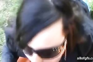 Hungry bimbo sucks her lover's moist penis outdoors