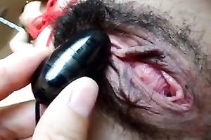 Diddling unshaved Asian fur pie of my girlfriend with egg sextoy