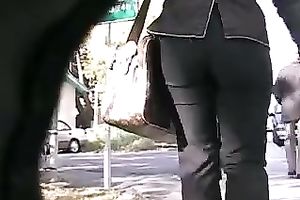 This large butted female-dominator looks glamorous in her taut panties