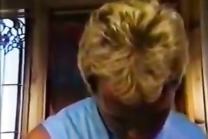 Busty blond gives oral stimulation to one well endowed guy