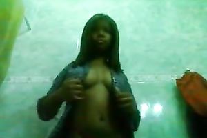 Amazing swarthy playgirl shows off her assets on a camera