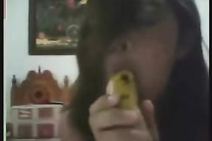 Exotic web camera bitch sucks a banana in advance of pushing it in her bushy vag
