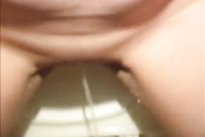 Nasty Asian milf disrobes and pees in the WC bowl