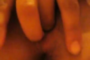 My concupiscent horny white wife entertains herself by fingering her unshaved love tunnel