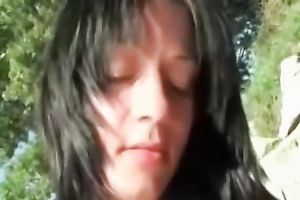 Raven haired bitch sucks her lover's rock hard pecker with excitement