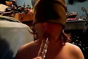 Blindfolded nympho sucks her gllassd marital-device like a dick