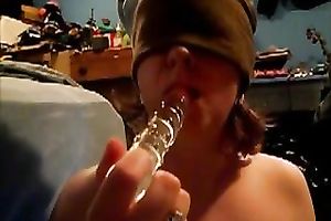 Blindfolded nympho sucks her gllassd marital-device like a dick