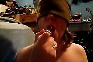 Blindfolded nympho sucks her gllassd marital-device like a dick