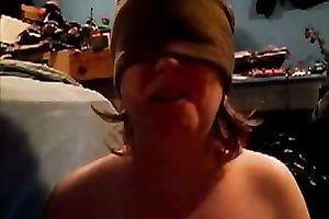 Blindfolded nympho sucks her gllassd marital-device like a dick