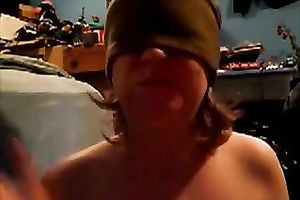 Blindfolded nympho sucks her gllassd marital-device like a dick