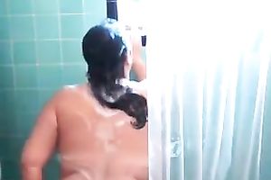 Brunette big beautiful woman washes her heavy bazookas in the shower