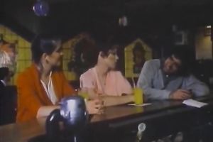 Curly-haired blond mama shows her oral-stimulation skills in retro sex movie scene