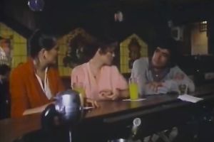 Curly-haired blond mama shows her oral-stimulation skills in retro sex movie scene