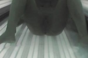 Sexy chick exposes her appetizing slit and her hot titties to the camera in solarium