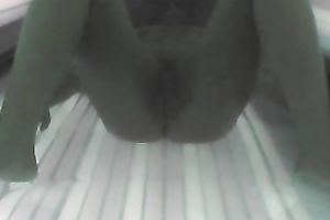 Sexy chick exposes her appetizing slit and her hot titties to the camera in solarium