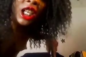 This dark camgirl is taking messy and fucking herself with the heel of her shoe