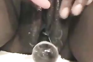 My ebon girlfriend copulates her dark soaked cum-hole with beaded glass toy