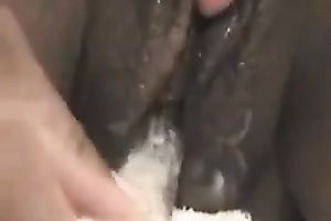 My ebon girlfriend copulates her dark soaked cum-hole with beaded glass toy