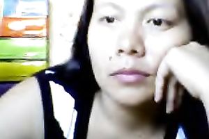 Bored Asian milf shows her love bubbles for the cam and kneads them