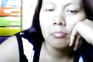 Bored Asian milf shows her love bubbles for the cam and kneads them