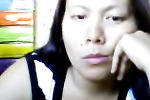Bored Asian milf shows her love bubbles for the cam and kneads them