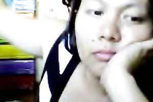 Bored Asian milf shows her love bubbles for the cam and kneads them