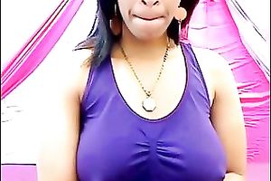 Huge-breasted ebon playgirl licks her nipples in front of a web camera