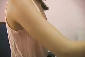 A excited Asian honey fingers her pussy at her work place