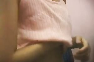 A excited Asian honey fingers her pussy at her work place