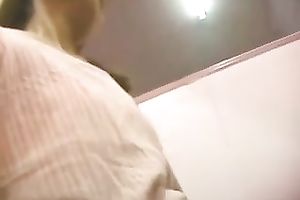 A excited Asian honey fingers her pussy at her work place