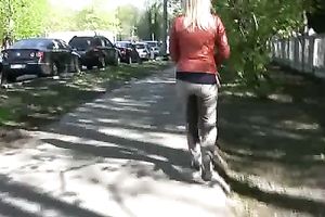 Crazy blond Irina pees her panties in the street in solo movie