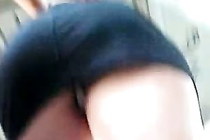 Upskirt outdoor scene with a cute honey wearing a miniskirt