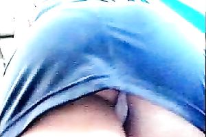 Upskirt outdoor scene with a cute honey wearing a miniskirt