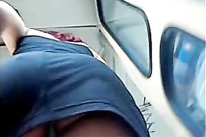 Upskirt outdoor scene with a cute honey wearing a miniskirt