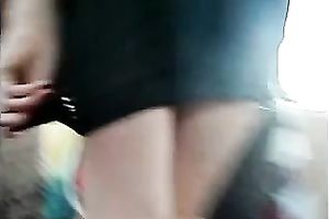 Upskirt outdoor scene with a cute honey wearing a miniskirt