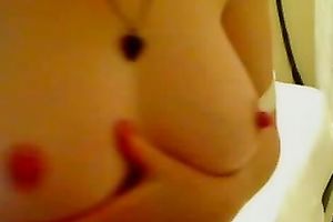 Wonderfully sexy camgirl is playing with her large boobies