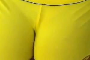 Delicious latin chick arse in yellow and taut bathing shorts